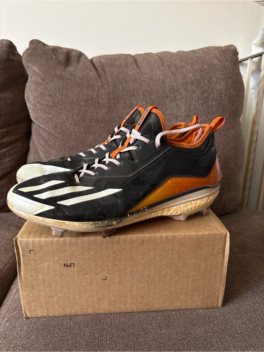 adidas Men’s Black and Orange Athletic Cleats